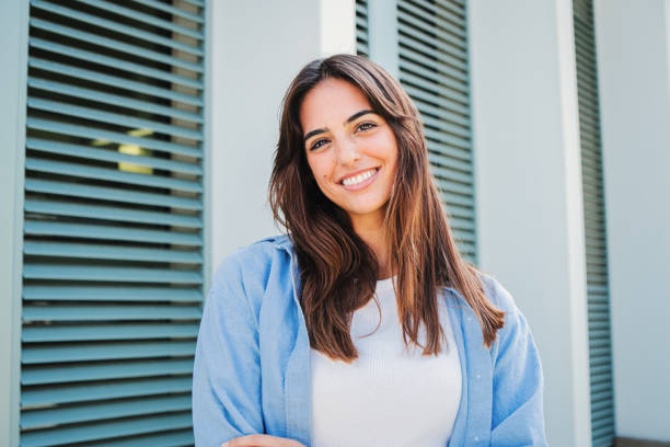 Happy Caucasian Young Student Female Looking At Camera Enjoying With A Perfect White Teeth
